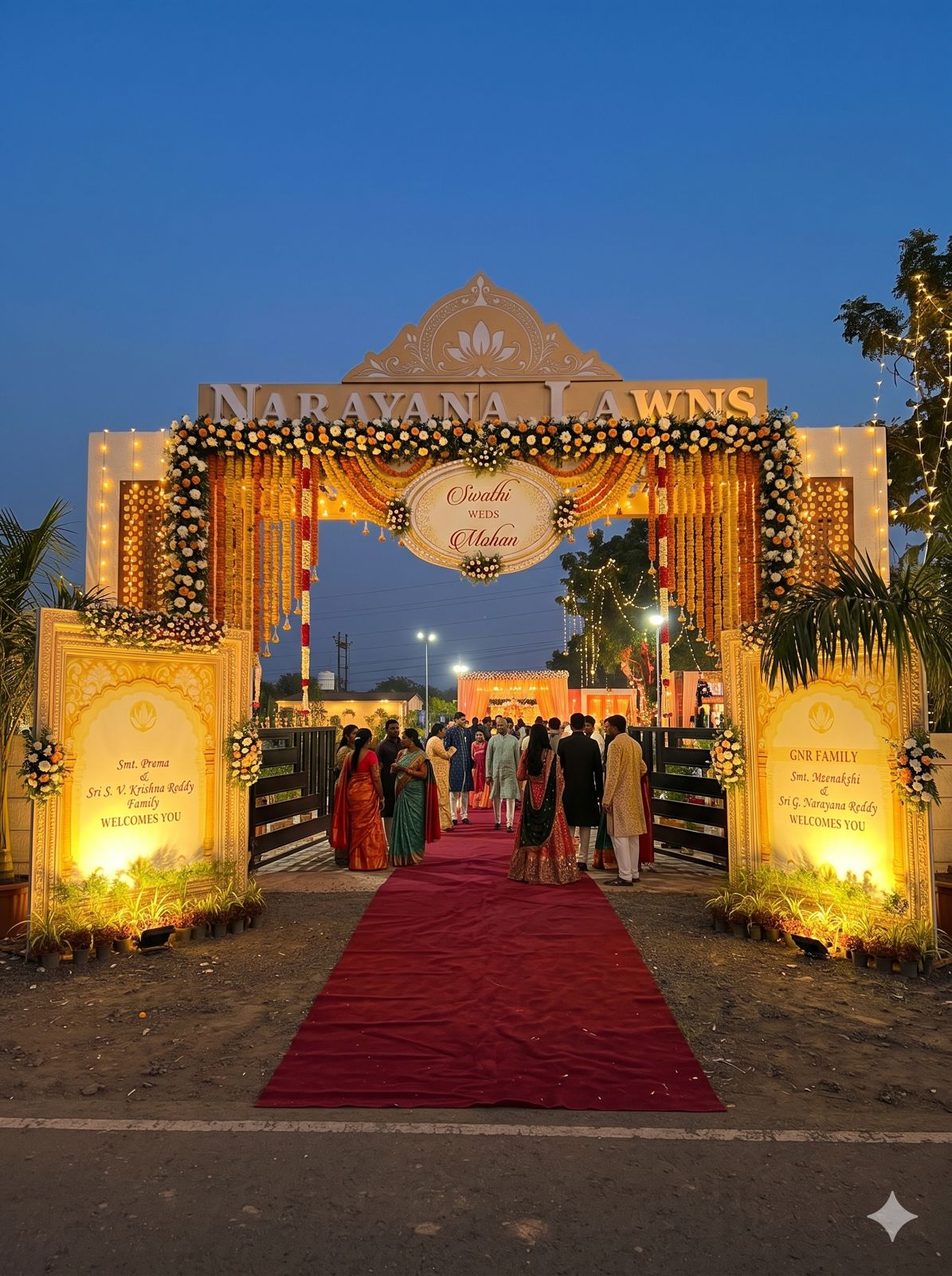 Floral entrance gate with red carpet and lamps